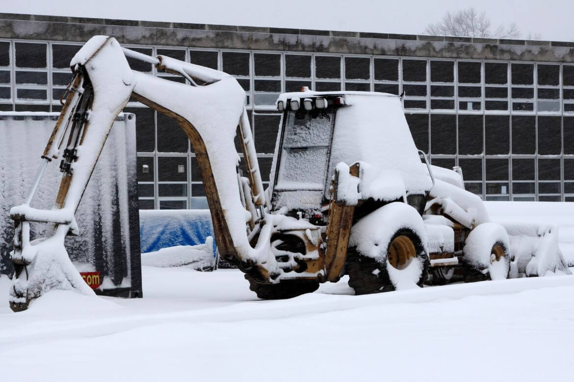 construction machinery in snow